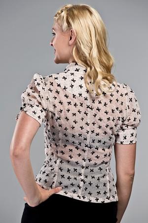 The sassy secretary blouse. Black flock bows on powder pink