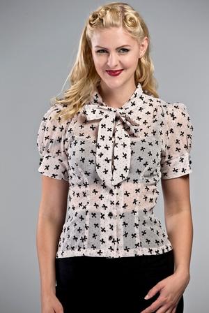 The sassy secretary blouse. Black flock bows on powder pink